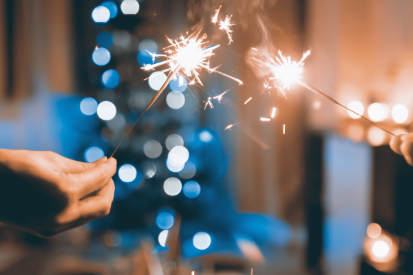 Two people holding sparklers