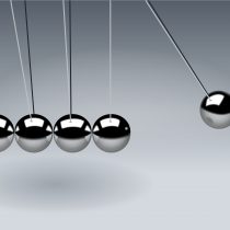 Newtons cradle on gray background