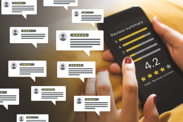 a person touching a mobile device with an online review displayed with 4.2 stars and an overlay of several nondescript word bubbles representing reviews