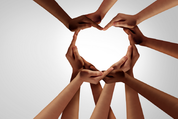 an image of five sets of hands forming a heart shape