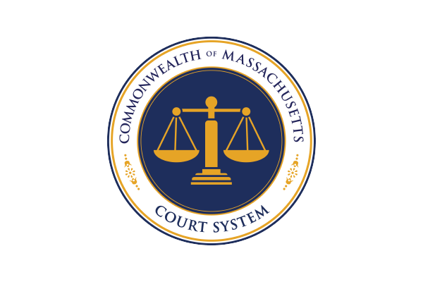 an image of the Massachusetts Court System Logo, a graphic of the scales of justice in gold on dark blue circle background