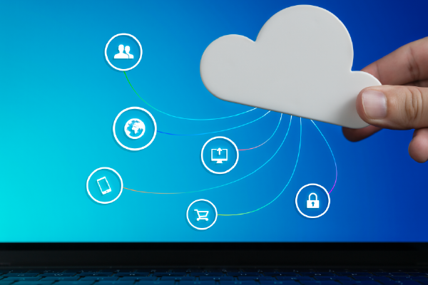 an image of fingertips holding a cutout of a cloud with a graphic overlay of office-related icons