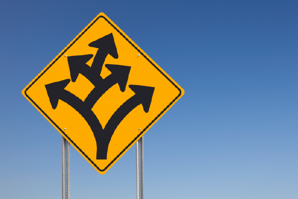 an image of a traffic sign showing a fork, with another fork extending from one side, and another fork extending from one side on the second fork, showing three in total, with a blue sky in the background