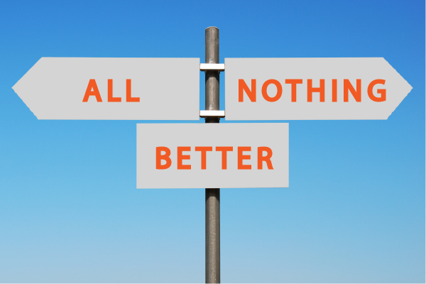an image of a signpost with arrows pointing in opposite directions, one that says 'all' and one that says 'nothing', and a third rectangular sign below in the middle that says 'better'