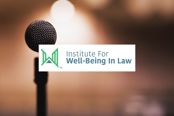 an image of a microphone and the logo of the Institute for Well-Being in Law