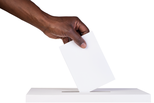 an image of a hand putting a ballot in a box